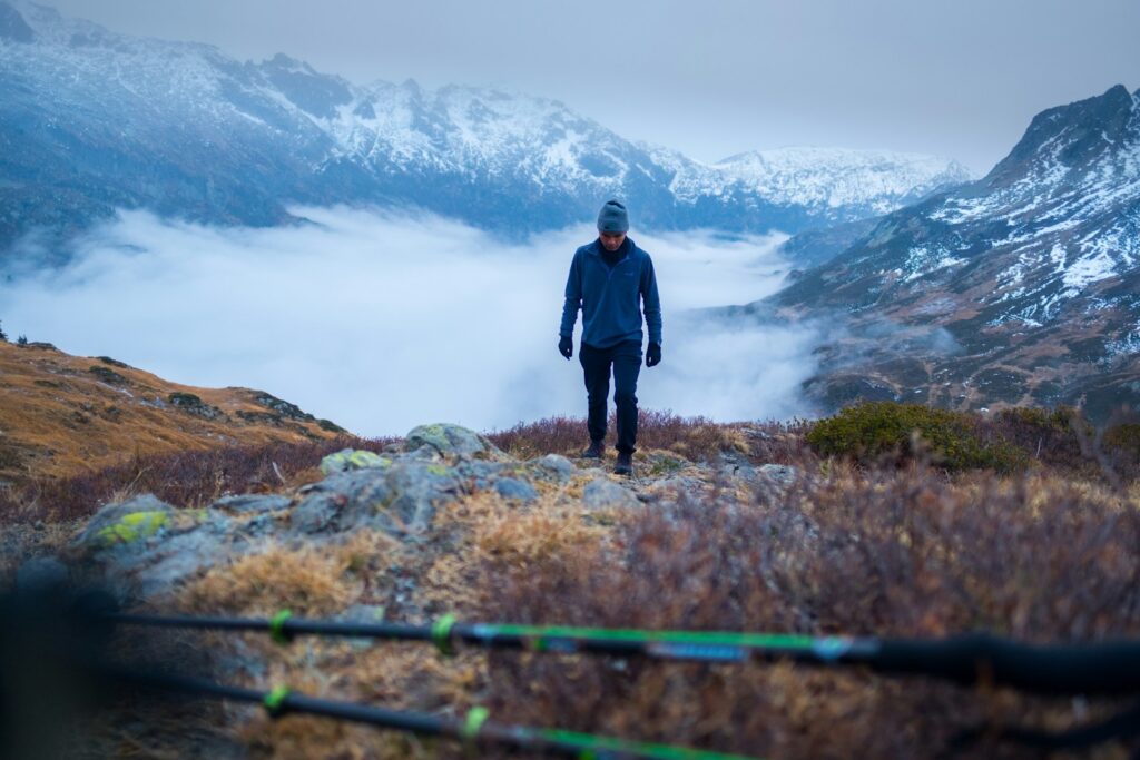 man walking upward on mountain