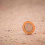 silver and gold round coin