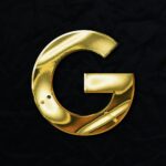 a gold letter g on a black background